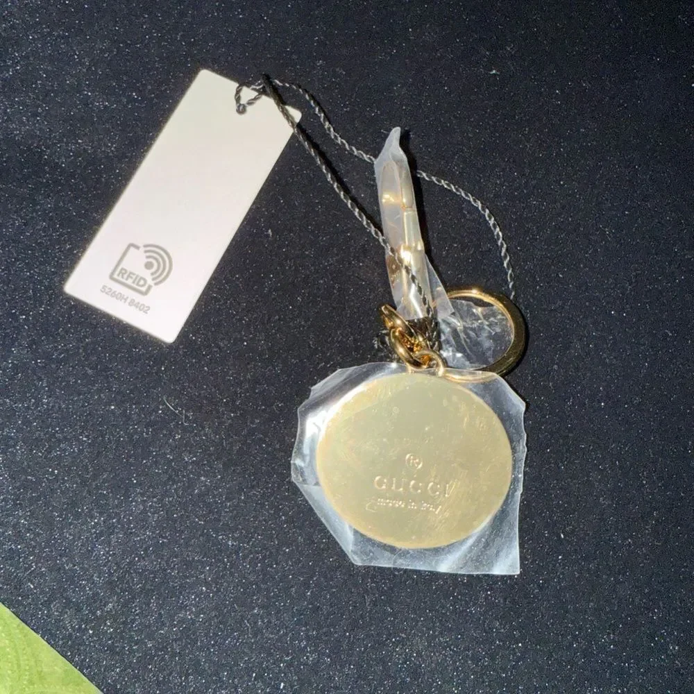 Brand new with box and dustbag Gucci Gold and Green Keychain